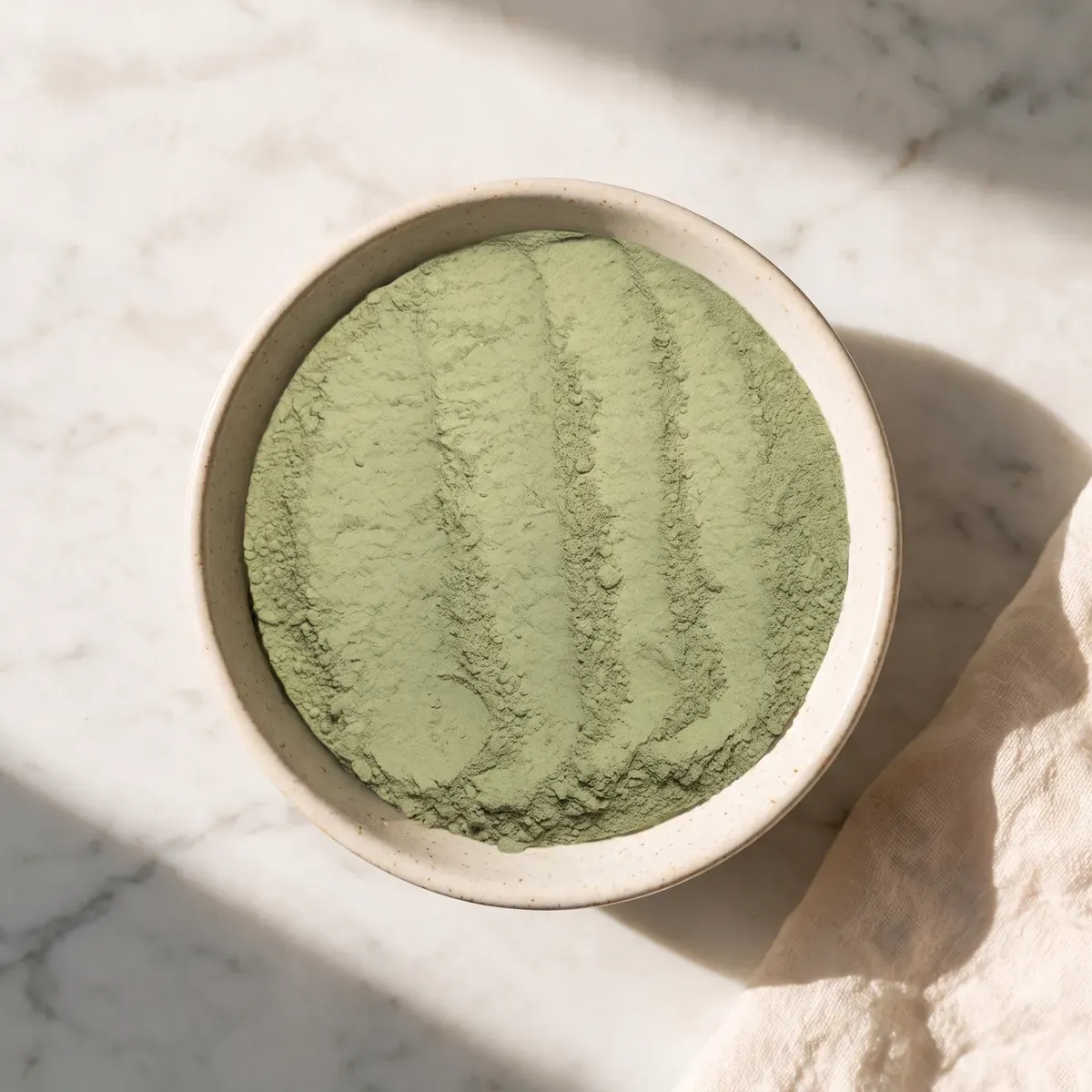 Alfalfa powder in a bowl — the single ingredient